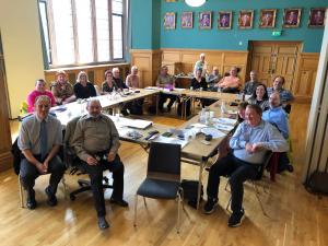 Image shows Imtac members at a meeting in Derry
